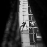 a few men working on a building